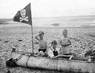 Playing pirates on the beach in 1943; picture supplied by Tom Dalzell