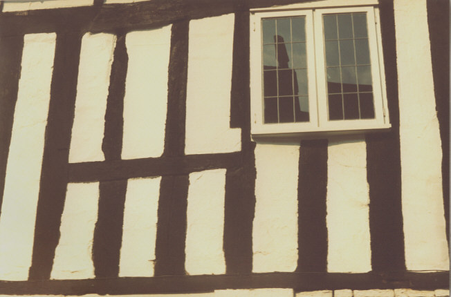 Nottinghamshire, England. Early autumn c1990. Timber framing in yard of the Saracen's Head Inn, Southwell.