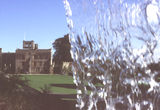 Nottinghamshire, England. Early autumn 1987. Newstead Abbey from the waterfall.