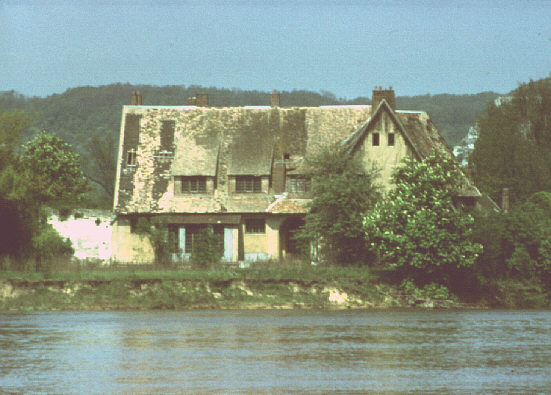 Lower Seine valley, France. Spring 1985. Old house on island in the river at Les Andelys, from south-east.