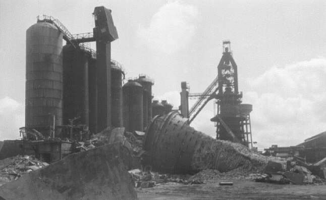 Millom ironworks, Cumbria, UK. Summer 1968. East end of blast furnace array from east, showing demolition in progress